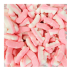 Vrac des bonbon dentiers en gélatine de chez Haribo, blancs et roses